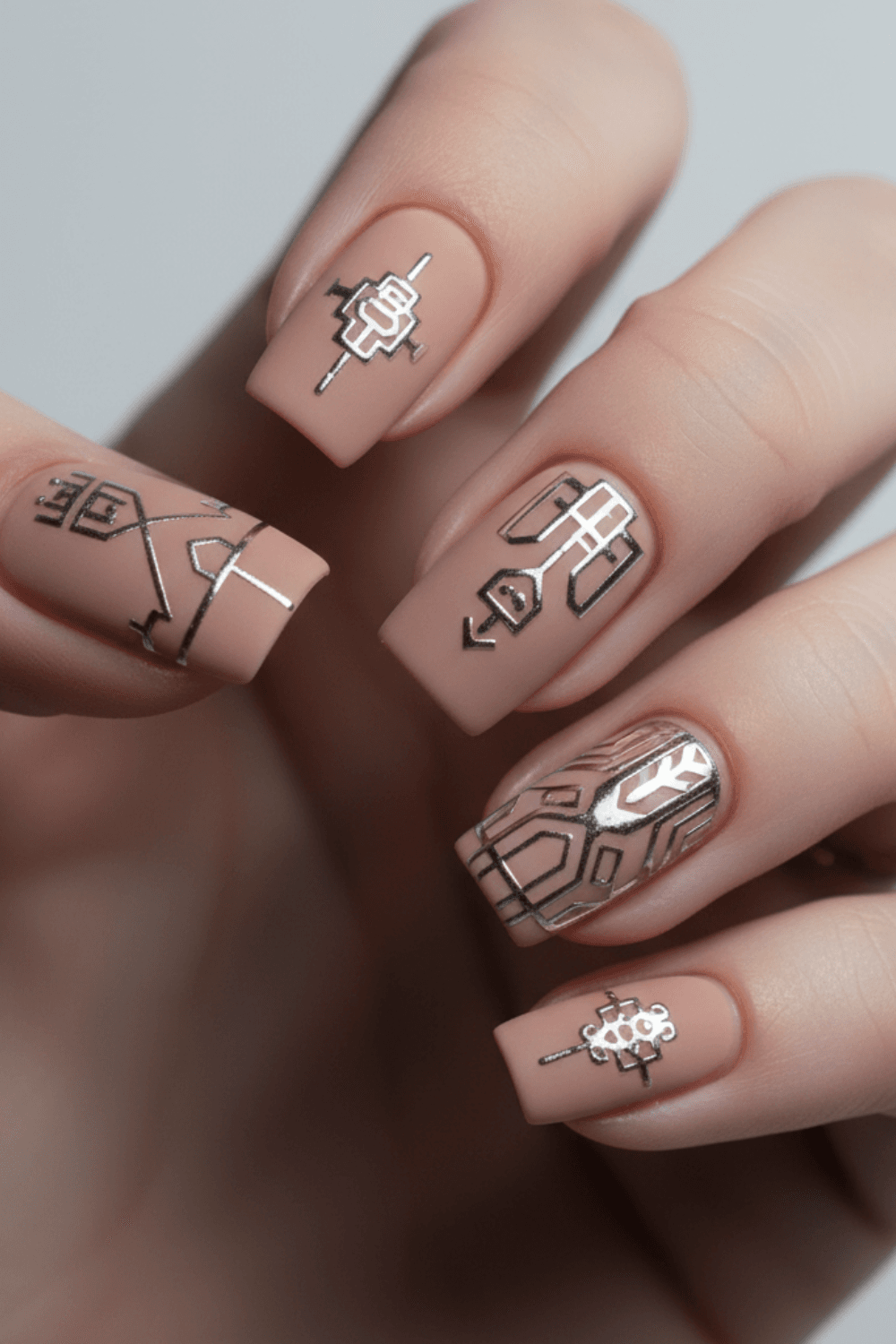 Digital chrome tattoo nail art with fine metallic silver details