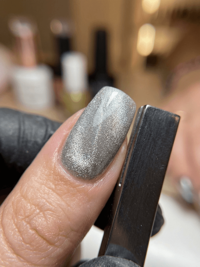 Professional magnet placement parallel to the nail sidewall to create a velvet effect